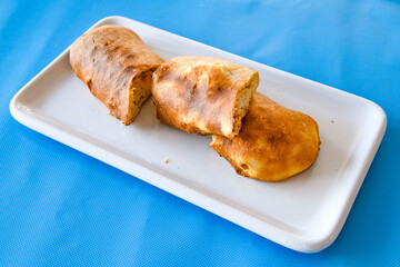 Turkish pastry product , tasty pogaca. Simit, gevrek. Turkish Pastries; peynirli, patatesli, kasarli pogaca, borek, acma, ay coregi at patisserie showcase.