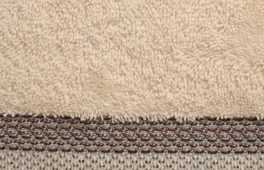 Fototapeta na wymiar Soft Terry fabric towel copy space background. Beige color.
