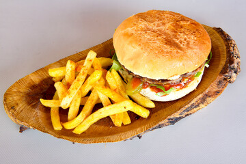 Big tasty  burger with beef cutlet on a plate. Hamburger.