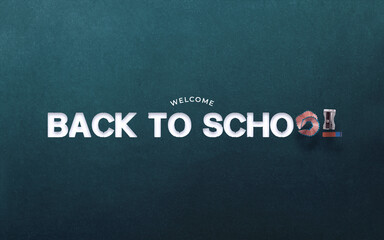 Fototapeta na wymiar Welcome Back to School Written with Chalk on Blue Blackboard