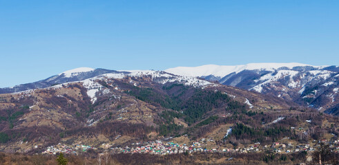 Spring landscape. Residential village houses on the slope of the Carpathian mountains.