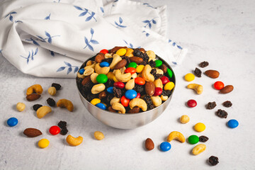 Classic trail mix in a bowl on a light background