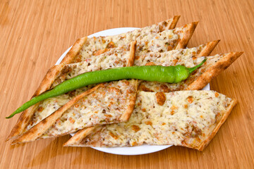Turkish pita with minced cubed meat and cheese (Turkish name: Kiyma Kusbasi kasarli pide)