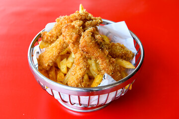 Fried Chicken breast hot crispy strips crunchy chicken tenders  isolated on white background.Nuggets isolated on white background on a plate