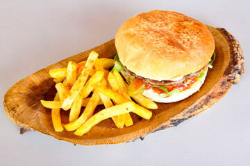 Big tasty  burger with beef cutlet on a plate. Hamburger.