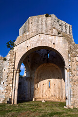 Fototapeta na wymiar Ruins of a medieval stone church next to the town of Magliano in Toscana