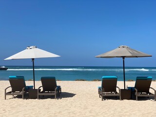 lounge chairs on the nusa dua beach Bali Indonesia
