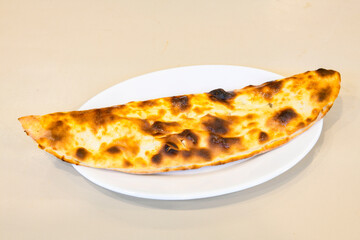Turkish pita with minced cubed meat and cheese (Turkish name: Kiyma Kusbasi kasarli pide)