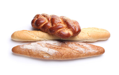 Assortment of baked bread on white background.