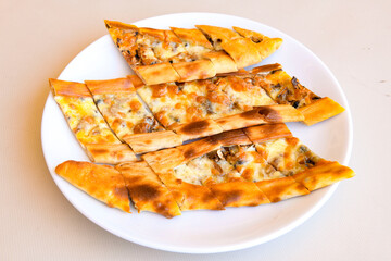 Turkish pita with minced cubed meat and cheese (Turkish name: Kiyma Kusbasi kasarli pide)
