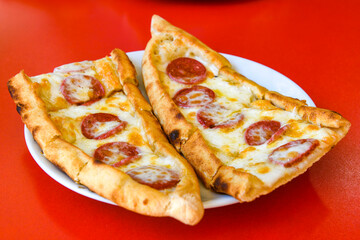 Turkish pita with minced cubed meat and cheese (Turkish name: Kiyma Kusbasi kasarli pide)