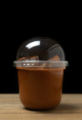 Ice milk tea sweet drink blurred on black