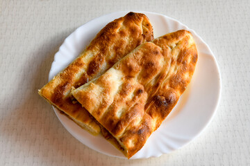 Turkish pita with minced cubed meat and cheese (Turkish name: Kiyma Kusbasi kasarli pide)