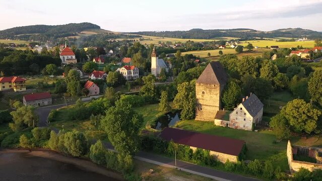 Historical Siedlecin town illuminated by the setting sun in the Bobr Valley Landscape Park, Lower Silesia. Poland