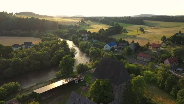Historical Siedlecin town illuminated by the setting sun in the Bobr Valley Landscape Park, Lower Silesia. Poland