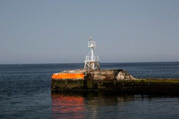 Fototapeta na wymiar Breakwater Light at Entrance to Ayr Harbour South West Scotland