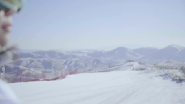 Young woman with snowboard on the snow,4K