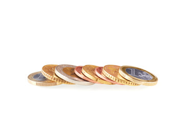 Several EU euro coins stacks isolated on white background. Metal coin money. Financial growth. Market crisis and fragile market. Close up view