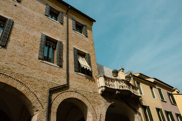 Detail of a beautiful old building in the main street of Padua against the blue sky.