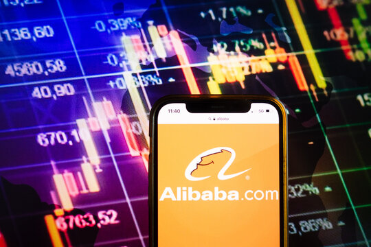 KONSKIE, POLAND - August 07, 2022: Smartphone displaying logo of Alibaba Group Holding Limited on stock exchange chart background