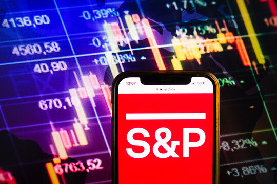 KONSKIE, POLAND - August 07, 2022: Smartphone Displaying Logo Of S&P Global Ratings (previously Standard & Poor's) American Credit Rating Agency On Stock Exchange Chart Background