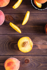 Sliced peaches on a wooden table. Organic vitamin food. Top and vertical view