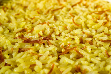 Close-up turmeric rice. Beautiful cooked rice in yellow color.