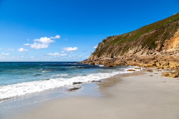 Fototapeta premium The sandy beach at Porth Nanven in Cornwall, at low tide