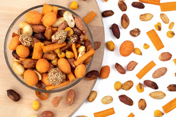 Mixed nuts and dry fruits on a white background. Top view.