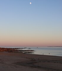 sunset and full moon at the beach