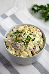 Homemade Healthy Potato Salad with Eggs in a Bowl, side view.