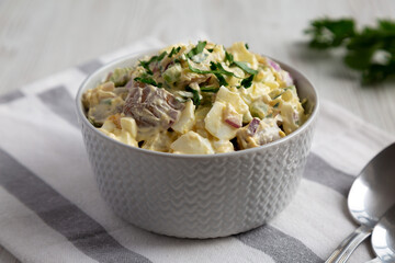 Homemade Healthy Potato Salad with Eggs in a Bowl, side view.