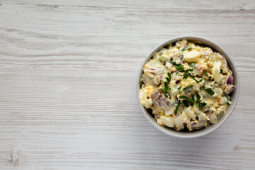 Homemade Healthy Potato Salad with Eggs in a Bowl, top view. Flat lay, overhead, from above. Copy space.