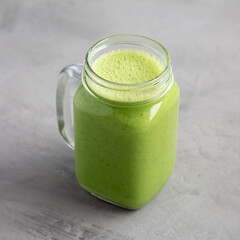 Homemade Greek Yogurt Green Smoothie in a Jar, side view.
