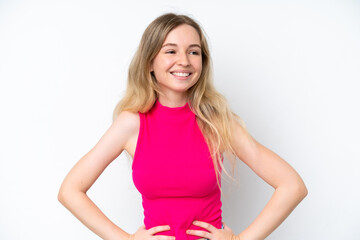 Blonde English young girl isolated on white background posing with arms at hip and smiling