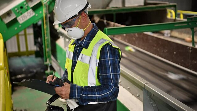 Waste Sorting Facility Management Control. Trash Conveyors Operator Performing Daily Check. 