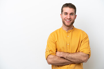 Obraz premium Young caucasian man isolated on white background keeping the arms crossed in frontal position