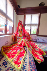 Young lady with her old style turkish traditional costume and headgear