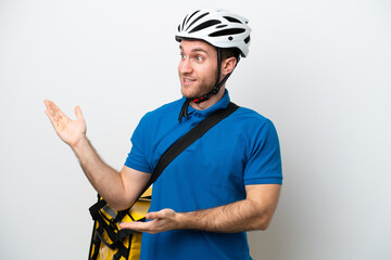 Young caucasian man with thermal backpack isolated on white background with surprise facial expression