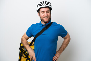 Young caucasian man with thermal backpack isolated on white background suffering from backache for having made an effort