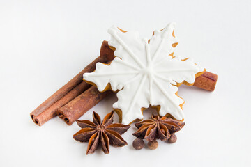Christmas and New Year holidays. Gingerbread and spices on a white background. Winter traditions. Christmas greeting. Preparation for a holiday postcard. Top view. - 521880605