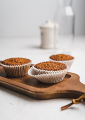 muffin cupcake paper mold carrot cake topped with whipped cream and berries