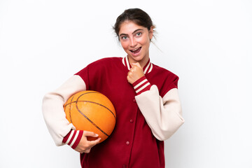 Young basketball player woman isolated on white background celebrating a victory