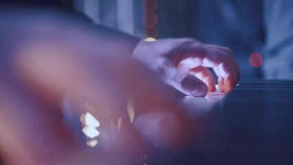 Playing a keyboard player in close-up from a musical group at an event