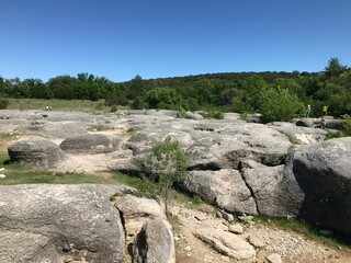 Closeup of Big Rocks Park (Glen Rose) surrounded by trees on a cloudless day in Texas