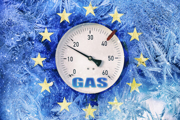 gas pressure gauge on background of frozen flag of European Union, energy crisis in European...