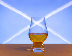 Traditional Scotch Whisky single malt turfed in glencairn glass with St. Andrew's cross in the...