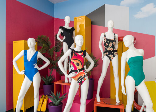 Mannequins in colorful swimsuits in clothes shop. Summer vacation. Fashion model. Colorful vacation concept