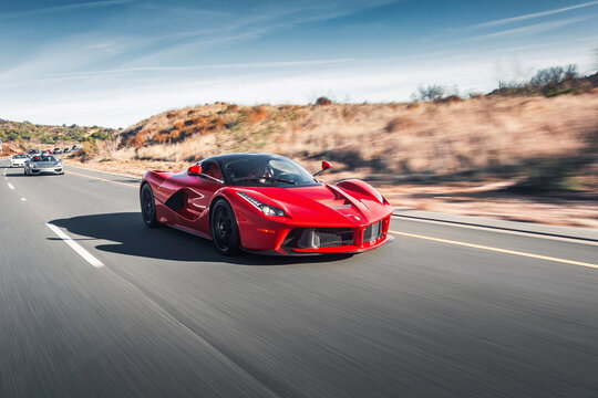 Los-Angeles, USA - June 2022: red supercar Ferrari LaFerrari in the motion.
