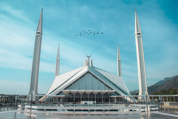 A beautiful view of faisal masjid with birds. unique picture of shah faisal mosque.